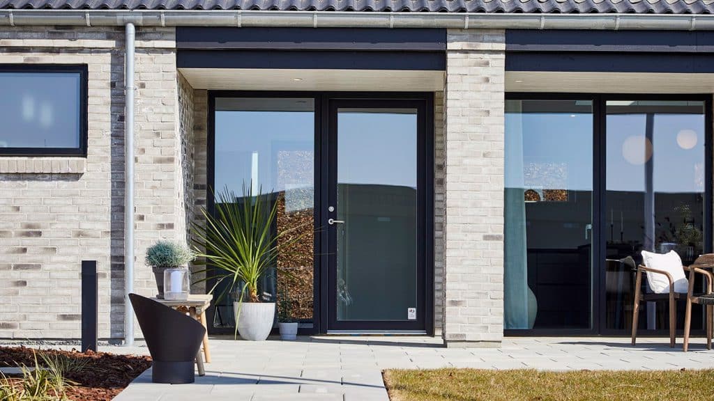 The exterior of a brick home.