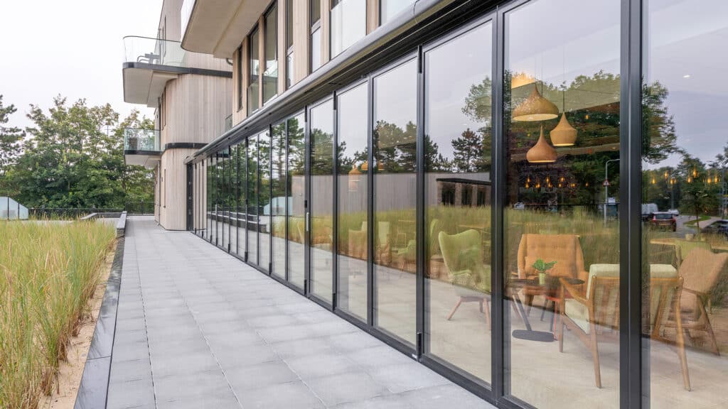 A black Bifold door that is shut.