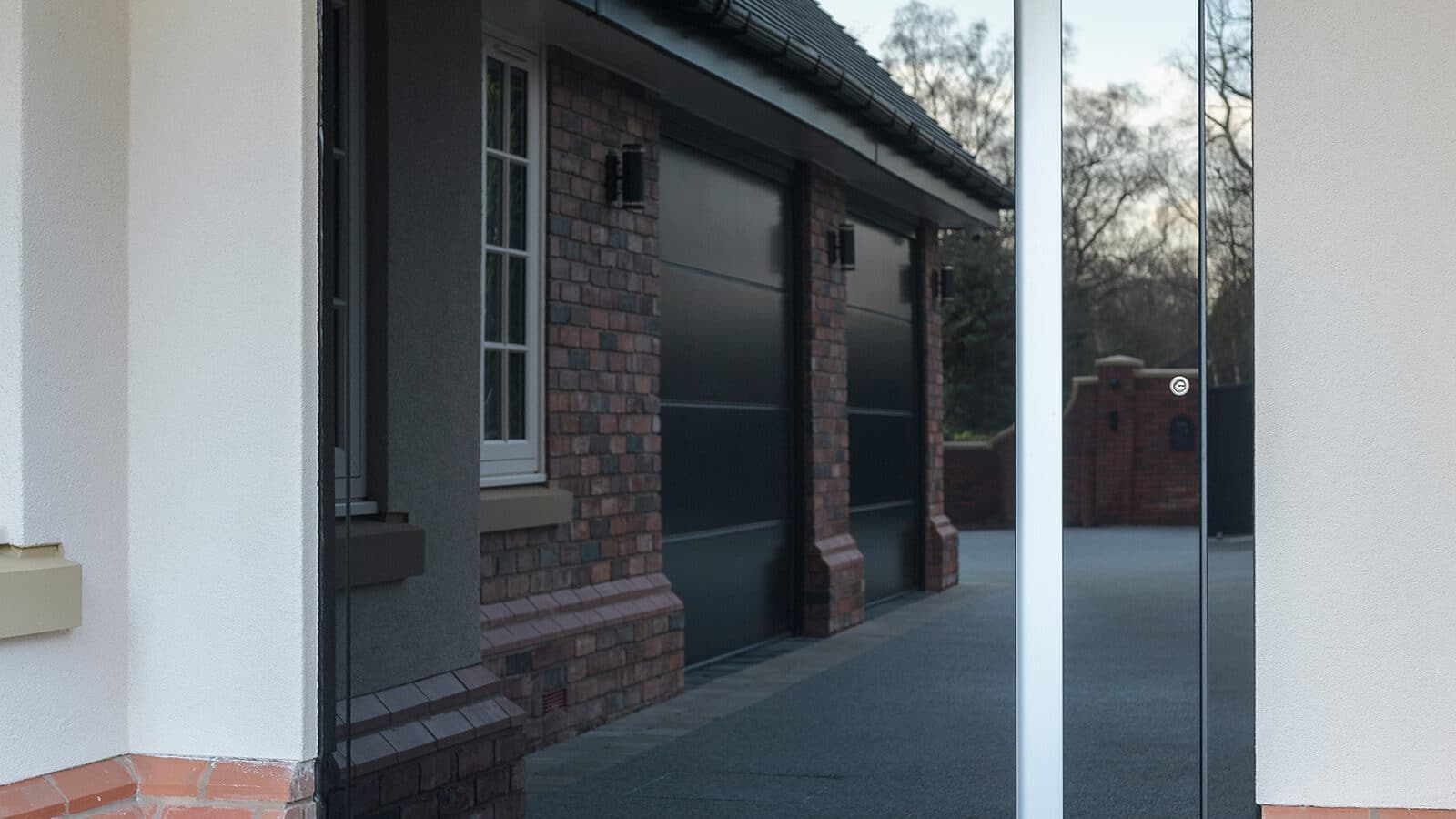 The exterior of a black S-700 Pivot Door